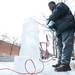 Van Calhoun makes a snowman out of ice using a chainsaw during Saline's Winterfest Saturday Jan. 26th.
Courtney Sacco I AnnArbor.com 